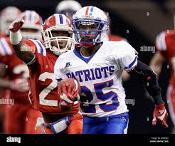 John Curtis running back Torrey Pierce (25) rushes past Evangel Christian  cornerback Brandon Stewart in the first half of the Class 2A high school  football championship in New Orleans, Friday, Dec. 10,