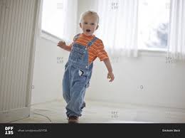 Free shipping on orders over $25 shipped by amazon. Toddler Boy Wearing Denim Overalls Stock Photo Offset