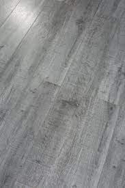 Pearl Leather 8 X 49 X 12mm Laminate Flooring In Gray Basementremodeling Grey Flooring Grey Vinyl Flooring Grey Laminate Flooring