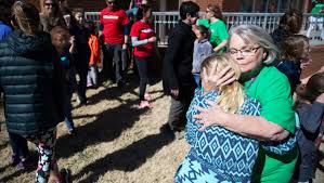 Students, parents, teachers join to "Hug Our School" at Stone Academy