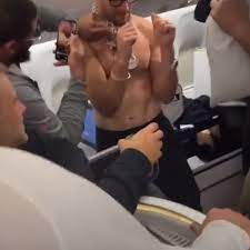 New angle of Kirk Cousins' topless celebration on private jet shows  team-mates' reactions - Mirror Online