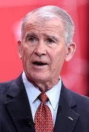 LtCol Oliver North talking with Gary Byron