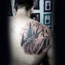 Wolf Howling At Moon With Pine Tree Mens Upper Back Tattoo Tree Tattoo Back Back Tattoo Designs Palm Tree Tattoo Ankle