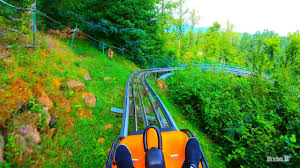 It's a cross between a roller coaster and toboggan sled run. Alpine Mountain Coaster Longest Downhill Track Smokey Mountain Alpine Coaster Youtube