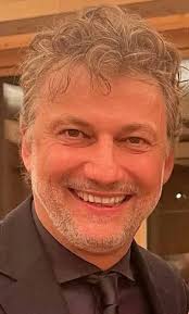 His unique voice, flawless legato, impeccable breath control, and  commanding stage presence established him as one of the greatest singers of  the century.