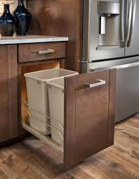 Double trash bin, tilt out trash can cabinet, rustic finish, barn door| plastic trash cans included, back is plywood. Kitchen Design Idea Hide Pull Out Trash Bins In Your Cabinetry