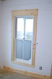 The colors are primarily white and beige, with gray and plaid accents. Diy Shiplap Walls And Farmhouse Trim Newlywoodwards