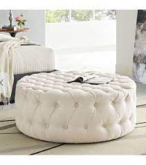 Round coffee tables offer an attractive contrast to the straight lines of most furniture. Beige Fabric All Over Button Tufted Round Ottoman Coffee Table