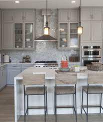 White kitchen cabinets give a clean, sleek look, while grey kitchen cabinets offer a more dramatic feel. Fenton Dove Gray With Glass Cabinets Kitchen Design Glass Cabinet Doors Kitchen Doors