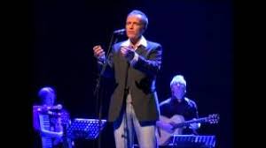 He sings in dutch (and occasionally in afrikaans). Stef Bos Papa 2008 Live Youtube