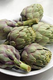 Place artichokes and garlic cut side down on a baking sheet. How To Prepare And Cook Artichokes David Lebovitz