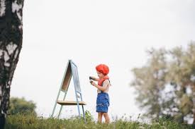 1920x1080 boy standing under tree at sunset imagem de fundo do papel de parede. Premium Photo Artist Boy Drawing In The Park At Sunset