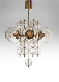 It features a warm and inviting amber & teal glass combination. Kamenicky Senov A Pair Of Czech Brass And Hand Blown Glass Chandeliers Offered By H M L Glass Chandelier Decorative Floor Lamps Hand Blown Glass Chandelier