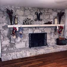 painted outdated brown stone fireplace with diluted amy howard chalk paint in spa white dra whitewash stone fireplace stone fireplace makeover stone fireplace