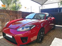 Image result for Electric Red 2005 Tiburon