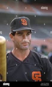 San Diego Padres Steve Garvey, center, follows through after connecting in  the sixth inning to single left and drive in teammate Alan Wiggins who  scored the Padres second and final run of