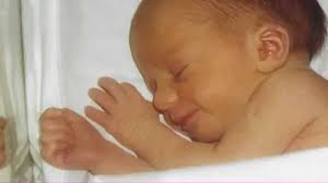 Birmingham midwife works with colleague who delivered her