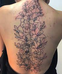 The options for flower tattoo designs are also endless given an array of flowers that one can choose from. Basic Knit Sweater Floral Back Tattoos Spine Tattoos Back Tattoo