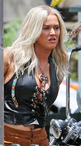 Women who operate fast vehicles are apparently attractive. Katy Perry Transforms Into A Biker Chick In Leather Corset For New Music Video