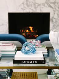 This wonderful trompe l'oeil table, handmade in italy of leather over wood, appears to be a stack of large old books but in fact offers two forms of storage. 10 Chic Home Accessories For Styling Your Coffee Table Luella June