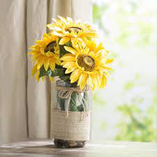 Sunflowers In A Vase With River Rocks And Faux Water Sunflower Centerpieces Water Centerpieces Flower Vases