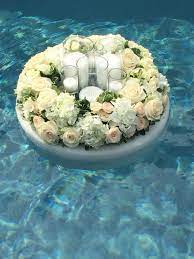 Maybe you would like to learn more about one of these? Floating Floral Wreath With White Flowers Including Hydrangea Roses And Spray Roses Candles Lit Pool Wedding Decorations Pool Wedding Floating Pool Flowers