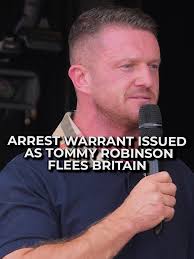 A High Court judge has issued a warrant for the arrest of Tommy Robinson,  after he fled the UK. It's after he breached a court order by showing a  film at a protest in central London. He was arrested ...