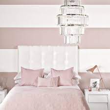 This deep purple wall color is paired wonderfully with neutral pieces, such as the white canopy bed, furniture, glass lamps; Bedroom Colour Schemes Colourful Bedrooms Bedroom Colours