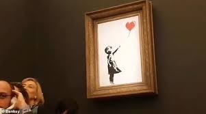 The financial times reported the painting was shredded by a contraption that seemed to be hidden in the frame. Banksy Appears To Be In Crowd Watching His Auction Stunt In Person As It Destroys 1m Painting Daily Mail Online