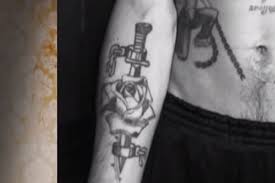 Cross with flowers inside tattoo. 12 Russian Prison Tattoos And Their Meanings