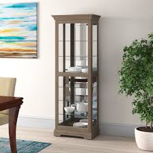 Burnished silver finish on select hardwoods and veneers is lightly wire brushed for a natural, reclaimed wood appearance. Howard Miller Bricelyn Lighted Curio Cabinet Perigold