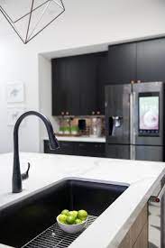 Featuring A Barely There Palette This Trend Centered On Subtlety Glorifies Nature Water And Organ Black Kitchen Sink Kitchen Sink Design White Kitchen Design
