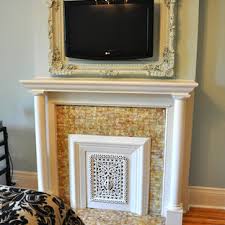 2) you don't really need to make this room look larger with a mirror. Framed Tv Above Fireplace Houzz
