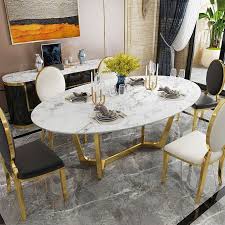 Marble is a soft stone, so although it is very dense, it is also rather vulnerable to staining and scratching. Oval Dining Table White Faux Marble Dining Table Modern 63 Dining Table With Gold Frame In 2021 Dining Table Marble Faux Marble Dining Table Oval Table Dining