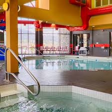 At adina apartment hotel copenhagen, guests can relax in the sauna, take a dip in the heated indoor swimming pool or work out in the fully equipped these hotels offer a great way to keep active during your holiday without having to hit the gym. Waterslide Indoor Pool Jetted Hot Tub At Best Western Plus Wine Country Hotel Suites