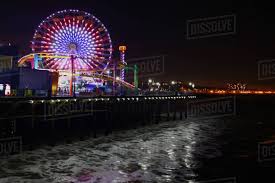 Opening of international festival the circle of light. The Santa Monica Pier At Night With Waves In The Foreground Stock Photo Dissolve