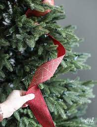 The crisscross method is the exact same as the barber pole method, except you run one barber pole. Tips And Tricks For Beautiful Christmas Tree Ribbon Video