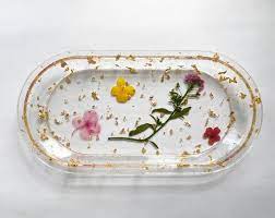 Don't push the flowers into the resin or else they may end up being dyed the color of your luster. Floral Resin Rolling Tray Jewelry Holder Etsy Diy Resin Projects Diy Resin Art Resin Crafts