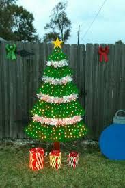 Wooden Christmas Tree We Made Out Of Plywood And 250 Lights And Some Garland Outside Christmas Decorations Christmas Tree Yard Christmas Yard Art