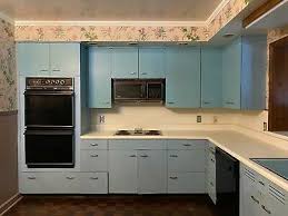 A warm garage is the ideal place to set up sawhorses and refinish the doors. Post 1950 Metal Kitchen Cabinets Vatican
