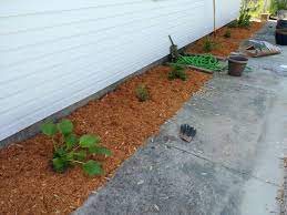 Reduces evaporation from the soil surface and holds moisture in. Can You Plant Flowers In Mulch What About Organic My Backyard Life