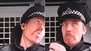 Police officer who filmed himself miming to rap music while