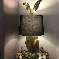 This beautiful round shade is supported by a simple column. Antique Gold Rabbit Table Lamp