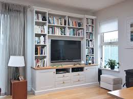 Painted in white to merge with the wall and give it a neat look, this space spells you do not need floor to ceiling space to place your pooja unit or create a pooja corner. Enigma Design Bespoke Shelving Unit Corner Tv Unit Tv Shelf Unit Wall Storage Unit