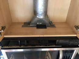 Here is a photo of the exhaust/chimney in the cabinet How Can I Remove A Mouse Stuck In The Air Duct Above A Kitchen Exhaust Fan With Built In Microwave Home Improvement Stack Exchange