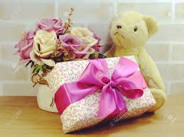 We offer flowers, plants, gift baskets, wedding flowers, sympathy flowers, event flowers and more. Cute Teddy Bear Doll With Gift Box And Flowers With Copy Space Stock Photo Picture And Royalty Free Image Image 83005183