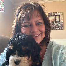 How much water should a 5-month-old Bernedoodle drink daily?