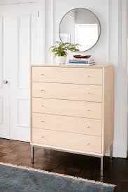 Each of the eight drawers feature two carved teak pulls. Dresser How To Style Your Bedroom Dresser For A Modern Look