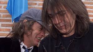 I'm Just Like a Color Over the Top. He's the Solid Thing”: Angus Young