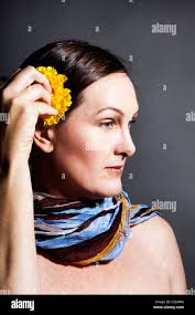 Woman flower ear hi-res stock photography and images